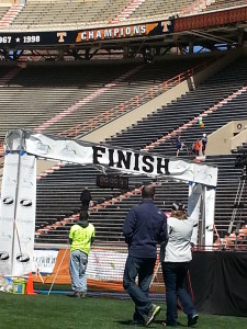 Do you see that kid way up in the bleachers kicking his leg up?  That's our 13 year old son.  He had just finished a half marathon, but he had the energy to stand up there and dance while he waited for us to finish.  I wish I had half his energy.