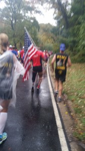Excuse the blurry picture. It's the best I could do while running in the rain. The guy in red is a wounded warrior. He lost one leg, and the other leg was badly injured. Watching him run was truly humbling and inspiring. 